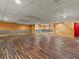 Finished basement with wood paneled walls and unique flooring at 2259 Eastway Rd, Decatur, GA 30033