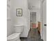 Bathroom featuring a toilet and shower area with tile floors at 2259 Eastway Rd, Decatur, GA 30033
