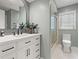 Updated bathroom features a modern vanity, sleek fixtures, and a tiled shower with glass door at 2259 Eastway Rd, Decatur, GA 30033