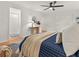 Bright bedroom with wood floors, modern ceiling fan, with an adjacent doorway to bathroom at 2259 Eastway Rd, Decatur, GA 30033