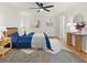 Cozy bedroom featuring wood floors, a ceiling fan, and modern decor at 2259 Eastway Rd, Decatur, GA 30033