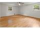 This bedroom features hardwood floors, natural light, and a ceiling fan at 2259 Eastway Rd, Decatur, GA 30033