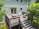 Elevated wooden deck featuring outdoor seating and a beautifully landscaped backyard at 2259 Eastway Rd, Decatur, GA 30033