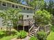 Beautiful backyard featuring an elevated wooden deck and mature trees at 2259 Eastway Rd, Decatur, GA 30033