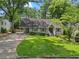 Charming home with a manicured lawn and mature trees providing shade at 2259 Eastway Rd, Decatur, GA 30033