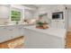 Bright kitchen featuring white cabinetry, stainless steel appliances, and a large central island at 2259 Eastway Rd, Decatur, GA 30033