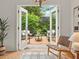 Charming outdoor deck and seating area surrounded by lush landscaping at 2259 Eastway Rd, Decatur, GA 30033