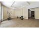 Finished basement area features workout equipment including an elliptical and rowing machine at 3450 Merganser Ln, Alpharetta, GA 30022