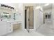 Bright bathroom with double vanity, shower, ceramic tile floors, and views of the hallway at 3450 Merganser Ln, Alpharetta, GA 30022