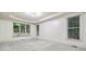 Large bedroom with plush carpet flooring, tray ceilings, and large windows providing natural light at 3450 Merganser Ln, Alpharetta, GA 30022