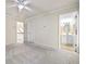Bright bedroom with neutral carpet, a ceiling fan, and a glimpse into the ensuite bathroom at 3450 Merganser Ln, Alpharetta, GA 30022