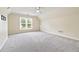 Large bonus room with a window and neutral-colored carpet at 3450 Merganser Ln, Alpharetta, GA 30022
