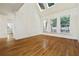 Versatile bonus room with hardwood floors, vaulted ceilings, and natural light from three windows at 3450 Merganser Ln, Alpharetta, GA 30022