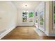 Breakfast nook with natural light, hardwood floors, and large windows overlooking the backyard at 3450 Merganser Ln, Alpharetta, GA 30022