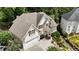 Beautiful home featuring a manicured lawn, two-car garage, and exquisite landscaping creating great curb appeal at 3450 Merganser Ln, Alpharetta, GA 30022