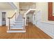 Spacious foyer with hardwood floors, staircase, and decorative moldings at 3450 Merganser Ln, Alpharetta, GA 30022