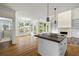 Modern kitchen with a central island, stainless steel appliances, and a bright breakfast nook at 3450 Merganser Ln, Alpharetta, GA 30022