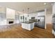 Gourmet kitchen with stainless steel appliances, ample cabinetry, and an eat-in island at 3450 Merganser Ln, Alpharetta, GA 30022