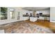 Spacious eat-in kitchen with stone countertops and an island with stainless steel appliances and hardwood flooring at 3450 Merganser Ln, Alpharetta, GA 30022