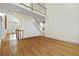 Open-concept living space with a staircase and hardwood flooring at 3450 Merganser Ln, Alpharetta, GA 30022