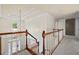 Elegant staircase featuring a chandelier, wood railing, and white trim overlooking the entry at 3450 Merganser Ln, Alpharetta, GA 30022