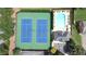 Aerial view of two tennis courts and a pool, highlighting community recreational amenities and parking at 3450 Merganser Ln, Alpharetta, GA 30022