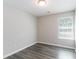 Clean bedroom features gray vinyl floors and a window for refreshing natural light at 4217 High Park Ln, Atlanta, GA 30344