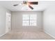 Spacious bedroom with ceiling fan and a large window providing plenty of natural light at 4217 High Park Ln, Atlanta, GA 30344