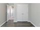 Bright bedroom with modern gray flooring and white doors creating an airy, inviting atmosphere at 4217 High Park Ln, Atlanta, GA 30344