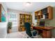 Inviting home office with built-in shelving, a spacious desk, and a comfortable chair at 4217 High Park Ln, Atlanta, GA 30344