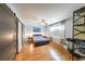 Serene bedroom with hardwood floors and sliding barn-style closet doors at 1026 Saint Charles Ne Ave # 15, Atlanta, GA 30306