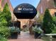 Beautiful brick apartment building with black awning and landscaping at 1026 Saint Charles Ne Ave # 15, Atlanta, GA 30306