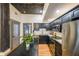 Modern kitchen featuring dark cabinets, stainless steel appliances, and a center island at 1026 Saint Charles Ne Ave # 15, Atlanta, GA 30306