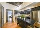 Modern kitchen with stainless steel appliances and a view to a bedroom at 1026 Saint Charles Ne Ave # 15, Atlanta, GA 30306