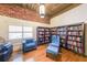 Cozy library featuring floor-to-ceiling bookshelves and comfortable armchairs at 1026 Saint Charles Ne Ave # 15, Atlanta, GA 30306