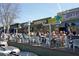 A vibrant outdoor patio with people enjoying a meal at Neighbor's restaurant at 1026 Saint Charles Ne Ave # 15, Atlanta, GA 30306