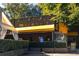 Outdoor view of Murphy's restaurant with awnings, signage, and outdoor seating, and foliage at 1026 Saint Charles Ne Ave # 15, Atlanta, GA 30306