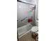 Bathroom featuring a large glass shower with safety bars and an elongated toilet at 200 Fox Hall Court Ct, South Fulton, GA 30349