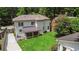 Backyard of this home, featuring a well-manicured lawn, patio and convenient driveway at 2505 Midway Rd, Decatur, GA 30030
