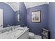 Stylish powder room featuring a marble countertop and a framed art piece at 2505 Midway Rd, Decatur, GA 30030
