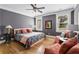 Cozy bedroom with hardwood floors, a ceiling fan, and ample natural light at 2505 Midway Rd, Decatur, GA 30030