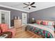 Comfortable bedroom with hardwood floors, closet access, and neutral wall color at 2505 Midway Rd, Decatur, GA 30030