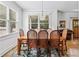 Bright dining room featuring a wooden table with seating for eight and large windows at 2505 Midway Rd, Decatur, GA 30030