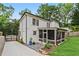 Charming home featuring a screened in porch, concrete drive, and lush green yard at 2505 Midway Rd, Decatur, GA 30030