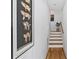 Hallway with hardwood floors and stairs leading up to the next level at 2505 Midway Rd, Decatur, GA 30030