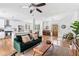 Spacious living room with hardwood floors that flows into the kitchen and dining room at 2505 Midway Rd, Decatur, GA 30030