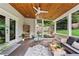 Comfortable screened porch features wood ceiling, cozy seating, and a backyard view at 2505 Midway Rd, Decatur, GA 30030