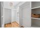 Walk-in closet with built-in shelving, hanging rods, and wood floors at 2505 Midway Rd, Decatur, GA 30030
