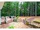 Expansive backyard featuring mature trees, a deck, and a decorative wrought iron fence at 4250 Green Ridge Dr, Marietta, GA 30062