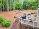 Backyard with mature trees, lush greenery, and an elevated deck, perfect for outdoor entertaining at 4250 Green Ridge Dr, Marietta, GA 30062